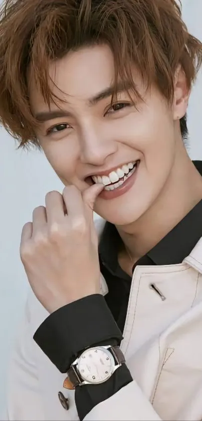 Stylish young man smiling with watch accessory.