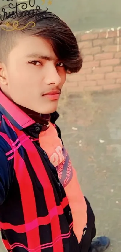 Young man in stylish outfit with modern hairstyle.