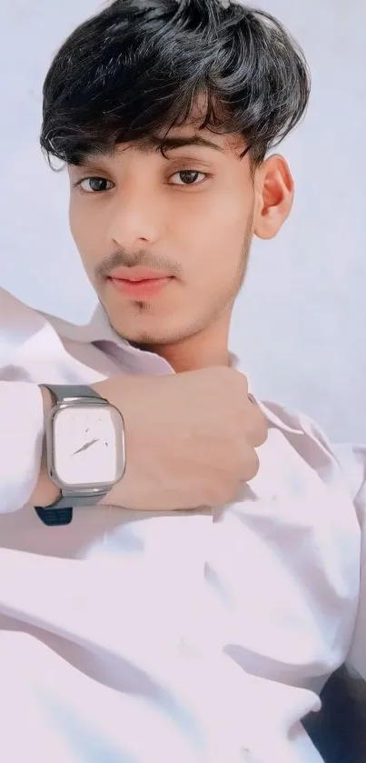 Trendy young man in a white shirt with a smartwatch.