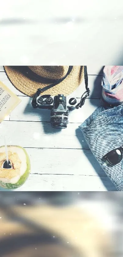 Flatlay with summer travel essentials on a pale blue background.