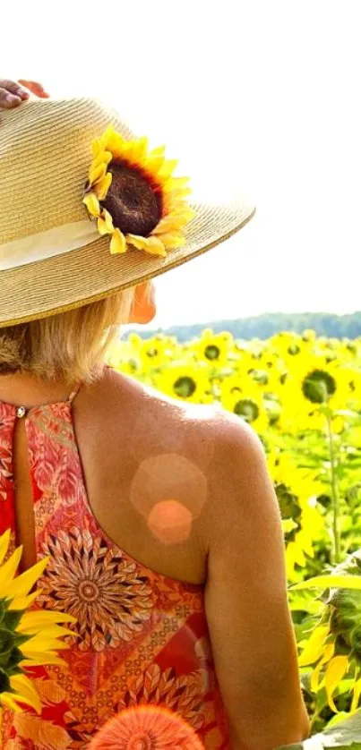 Woman in sunhat in a sunflower field, bright summer day.