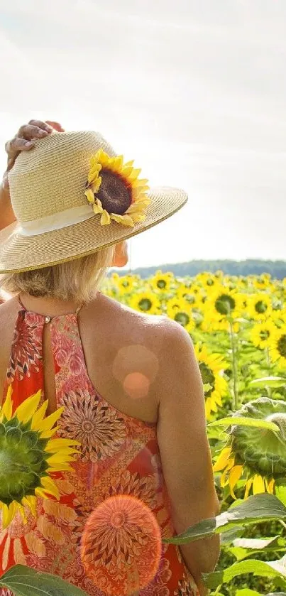 Woman in a vibrant sunflower field wearing a sunhat with a sunflower accent.