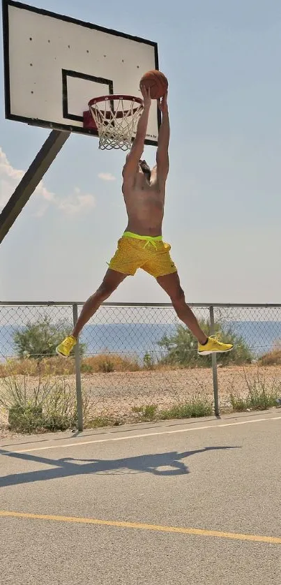 Energetic jump dunk on seaside basketball court.