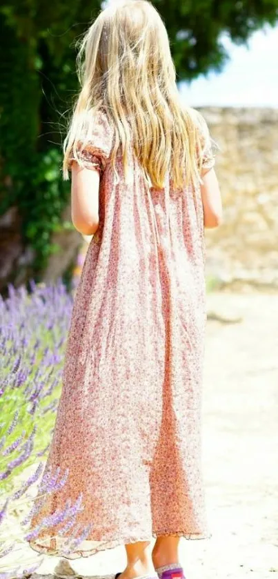 A young girl in a floral dress walking in a sunlit garden.