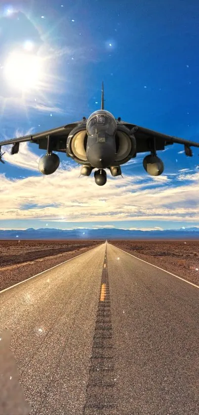 Jet flying over a desert road under clear blue sky.