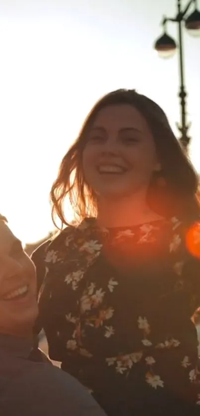 Joyful couple illuminated by sunset light, exuding warmth and happiness.