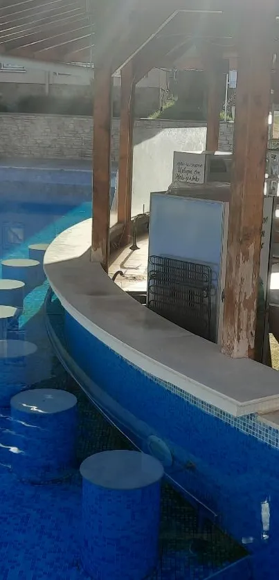 Sunlit poolside bar with blue water tiles.