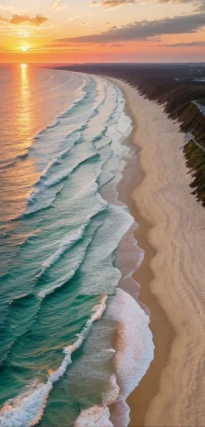 Aerial view of a sandy beach and ocean waves at sunset, perfect for mobile wallpaper.