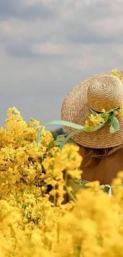 Woman in straw hat in a sunny yellow flower field.