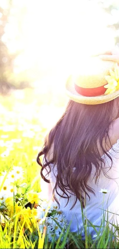 Woman in sunlit flower field wearing a straw hat.