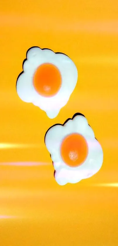 Sunny side up eggs on a bright yellow background.