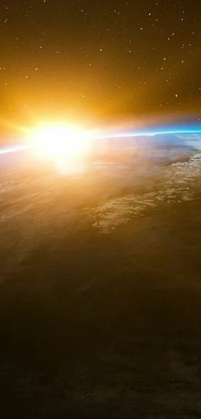 Sunrise over Earth's horizon seen from space, in golden and blue hues.