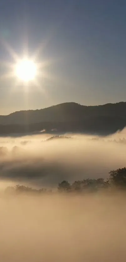 Serene sunrise over misty mountains with a glowing sun.