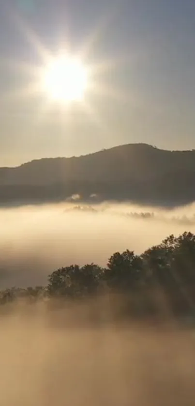 Sunrise with mist over mountains creating a tranquil scene.