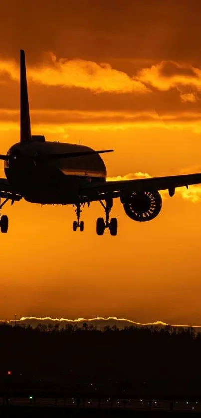 Airplane silhouette at sunset with orange sky.