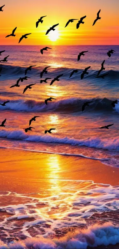 Birds flying over ocean during a vivid sunset.