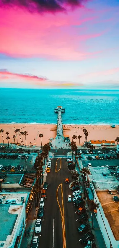 Aerial view of a pier with vibrant sunset and ocean backdrop.