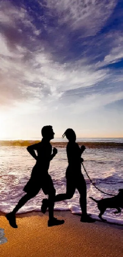 Two runners with a dog at sunset on a scenic beach with waves.