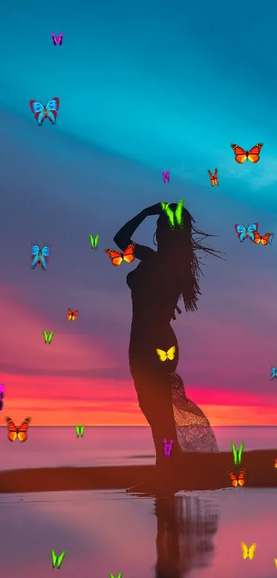 Silhouette on beach at sunset with vibrant sky.
