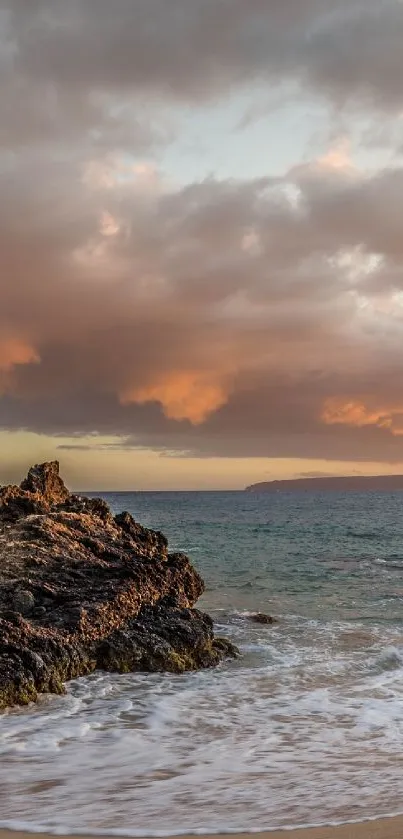 Stunning beach with sunset and waves, creating a serene mobile wallpaper.