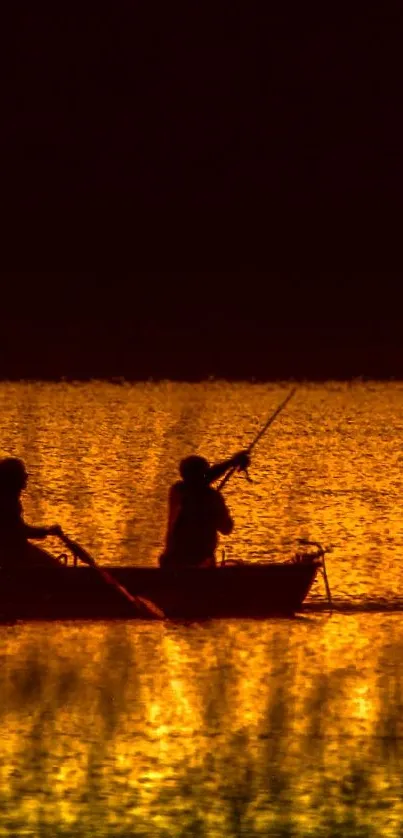 Silhouette of a boat on a golden sunset background with reflections on the water.