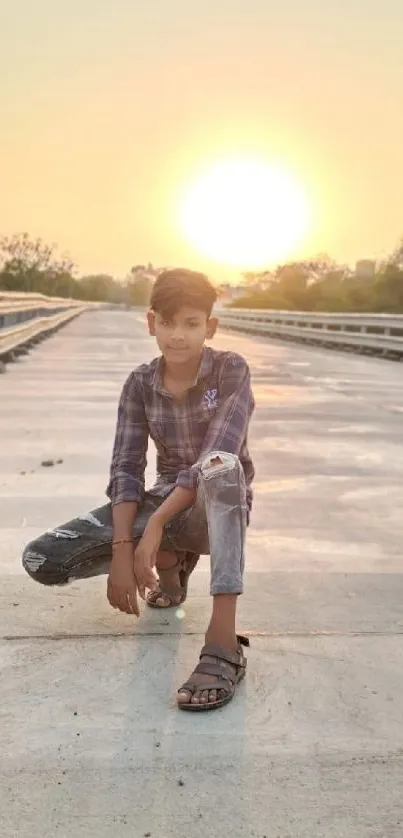 Young boy on a bridge at sunset, capturing a moment of adventure.