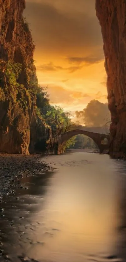 Sunset over canyon with ancient bridge reflecting in calm river.