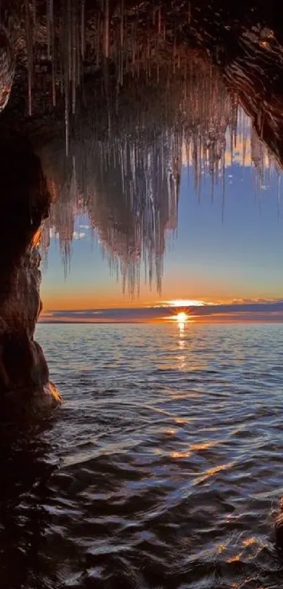 Sunset seen from a sea cave with icicles and ocean view.