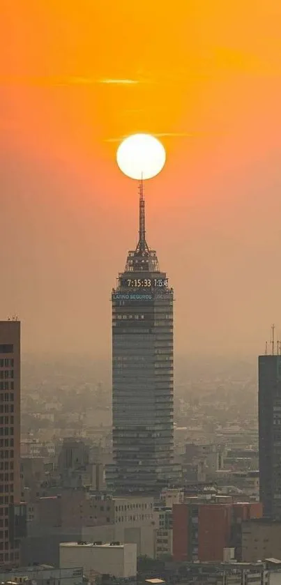 Orange sunset over city skyline with prominent skyscraper.