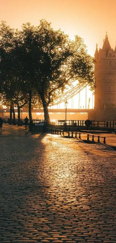 Golden sunset over a historic bridge and cobblestone path.