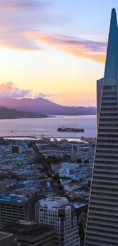 A sunset cityscape with a prominent triangular skyscraper overlooking the water.