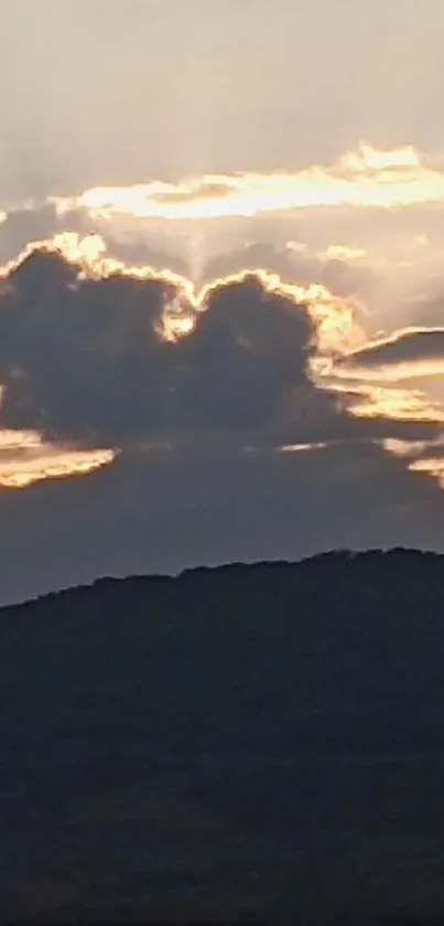 Dramatic clouds with sunset over hills scenery.