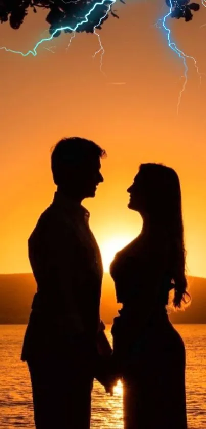 Silhouette of couple at sunset with lightning in the sky.