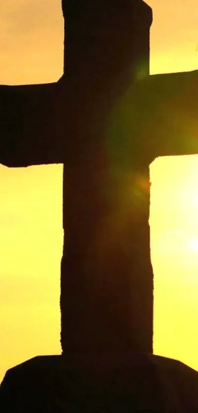 Silhouette of a cross at sunset with blessing text.