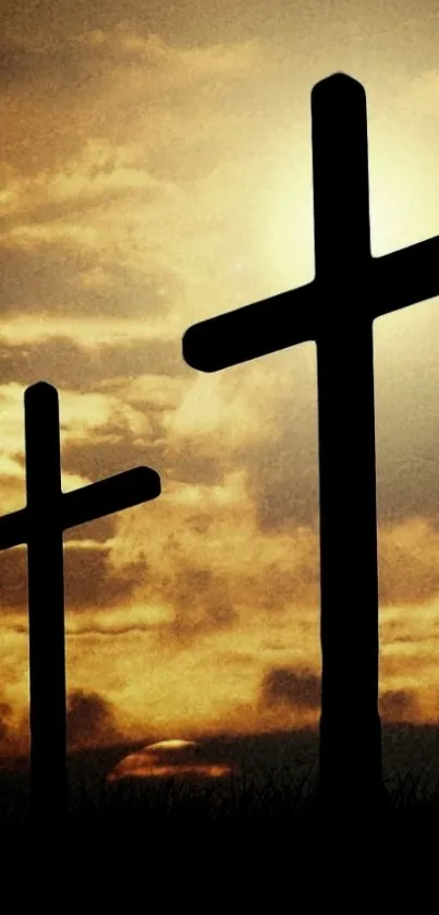 Silhouetted crosses against a golden sunset sky mobile wallpaper.