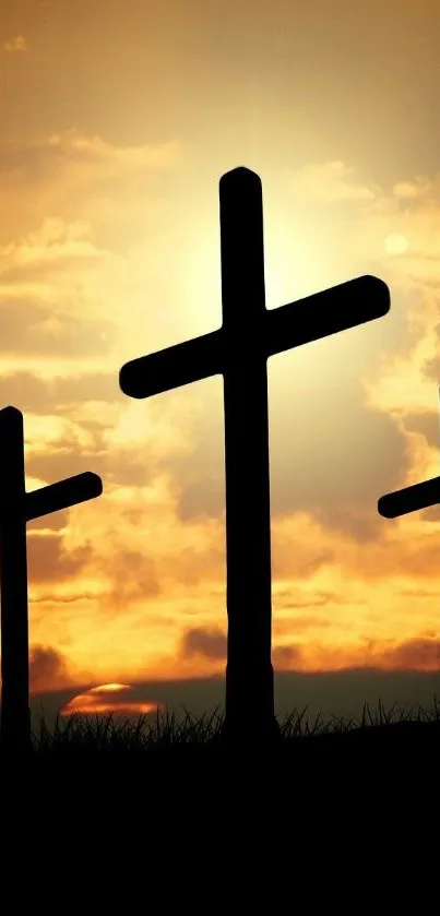 Silhouette of three crosses against a sunset sky for mobile wallpaper.