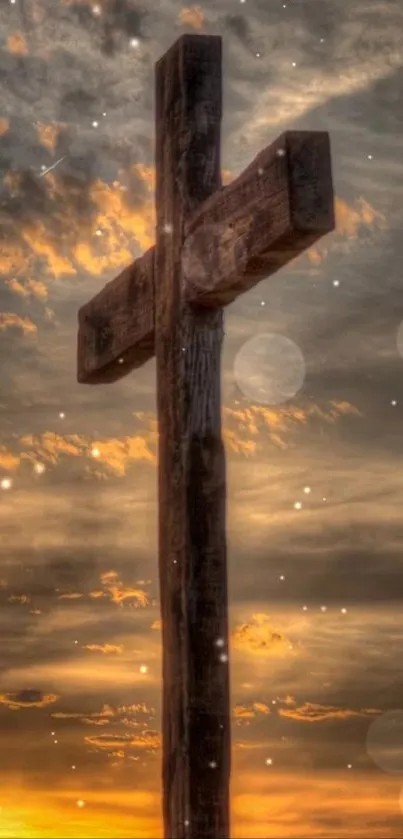 Wooden cross silhouetted against a vibrant sunset sky.