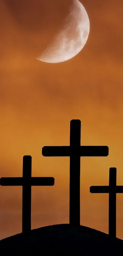 Three crosses silhouetted against a vibrant sunset sky with a half moon.