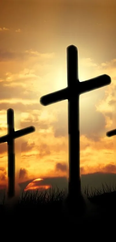 Silhouetted crosses set against a dramatic sunset sky.