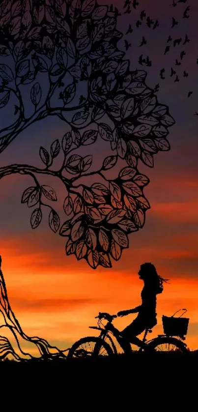 Silhouette of cyclist under a tree at sunset with vibrant sky.