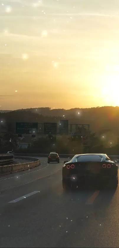 Dramatic sunset view over highway with cars in silhouette.