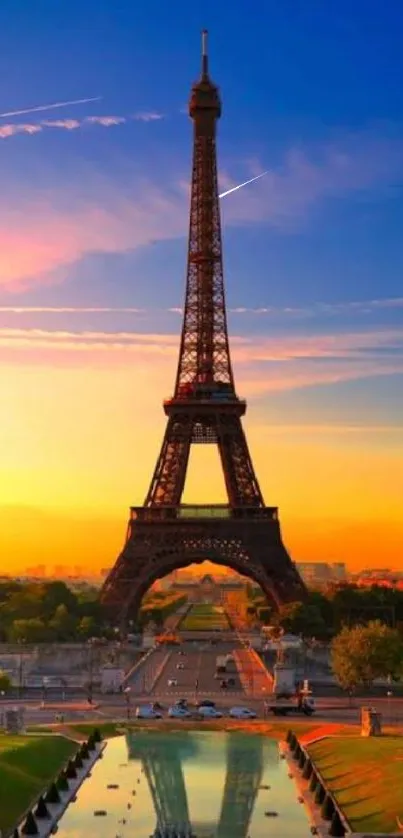 Eiffel Tower at sunset with vibrant orange sky.