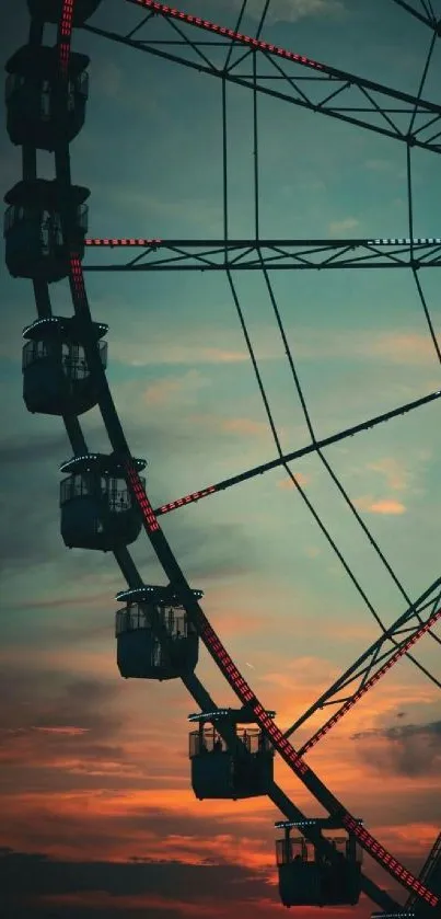 Silhouette of a Ferris wheel against a vibrant sunset sky.