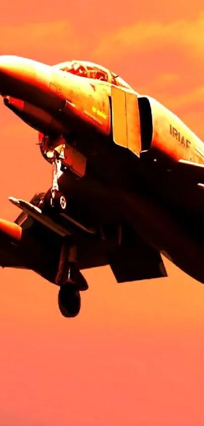 Sunset fighter jet in vivid orange sky.