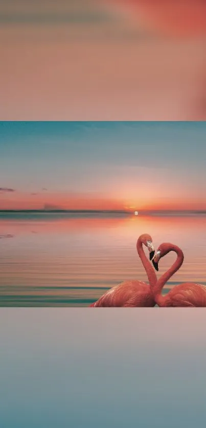 Flamingos forming heart with sunset backdrop.