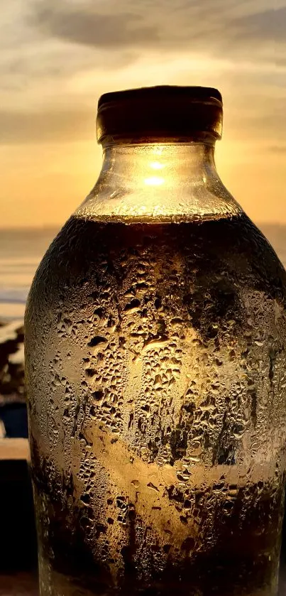 Sunset glow through a glass bottle with ocean view.