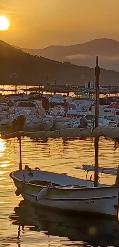 Serene sunset over Port de la Selva harbor with boats.