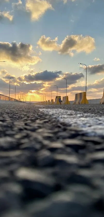 Highway with sunset and clouds, creating a dramatic sky view.