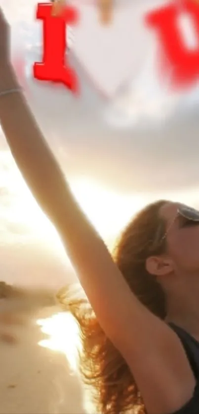 Silhouette of a woman at sunset with arms raised in joy.