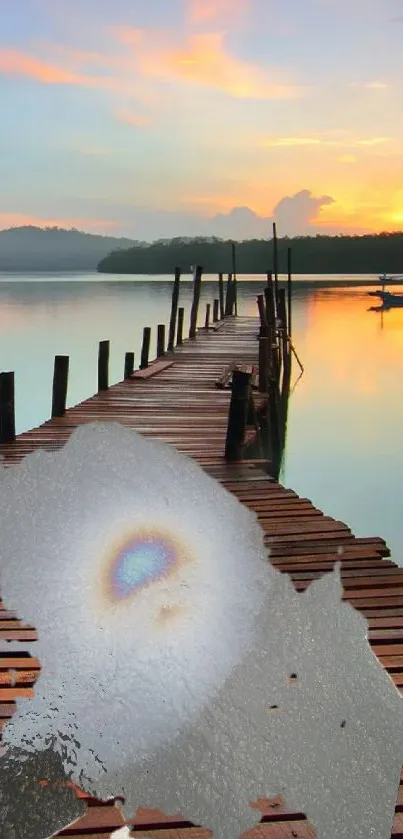 Scenic sunset over a lake with a wooden pier.